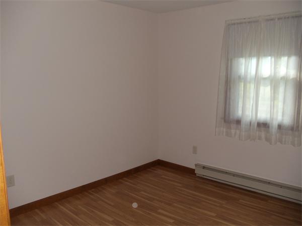 17 Meadow Road Ware, MA 01082 - Photo 8 of 15 a view of an empty room and wooden floor