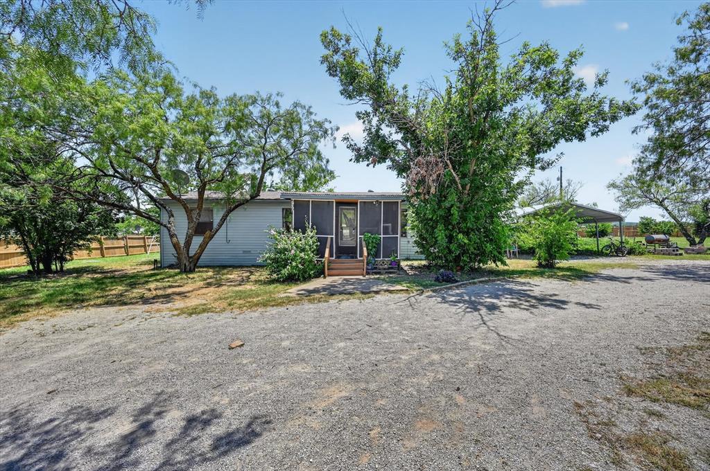 736 Little Joe Road Sanger, TX 76266 - Photo 2 of 17 Exterior with light-colored siding and a screened porch