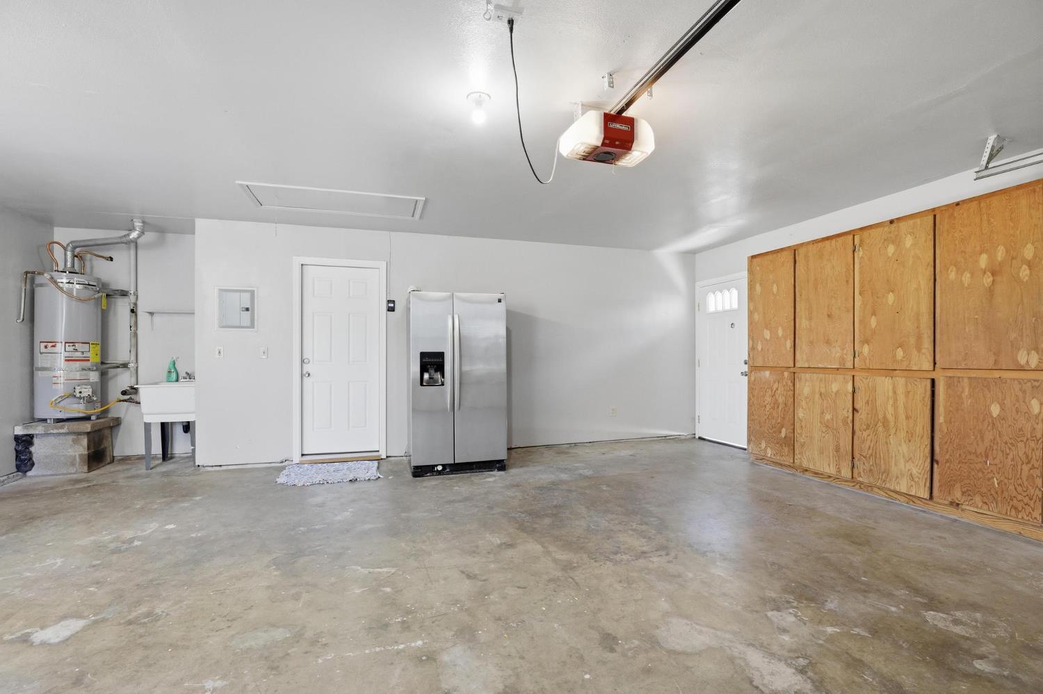 620 Teesdale Road Yuba City, CA 95991 - Photo 40 of 48 Oversize 2-car Garage with nice Fridge and added room for workspace to Left
