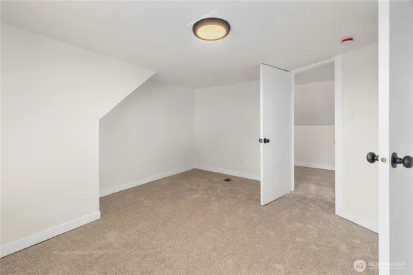 an empty room with a fan