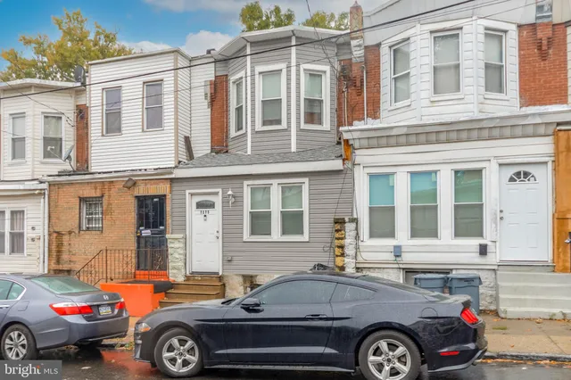 a front view of a house with parking space