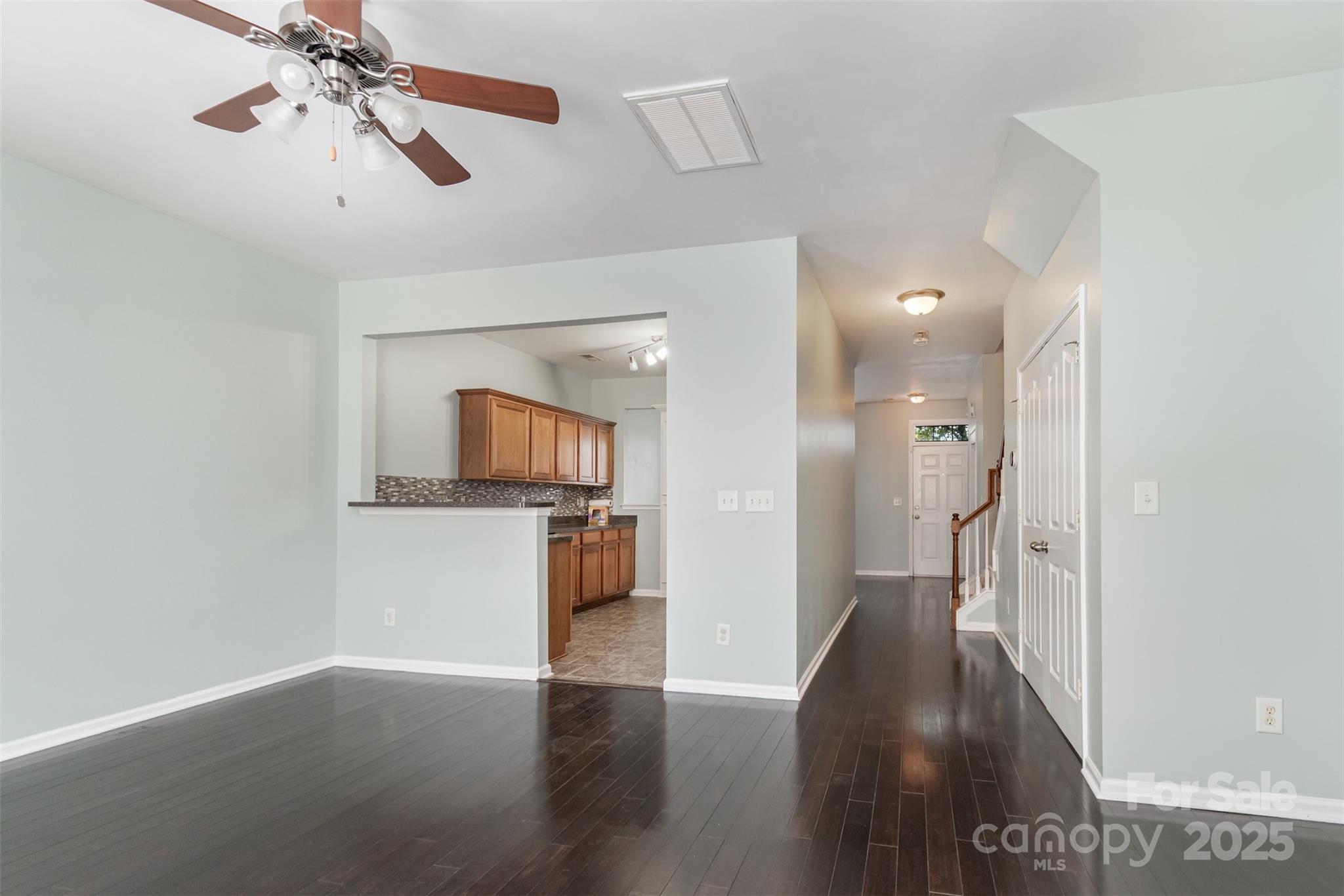 7367 Laurel Valley Road Charlotte, NC 28273 - Photo 6 of 21 a view of a hallway view with wooden floor and a living room