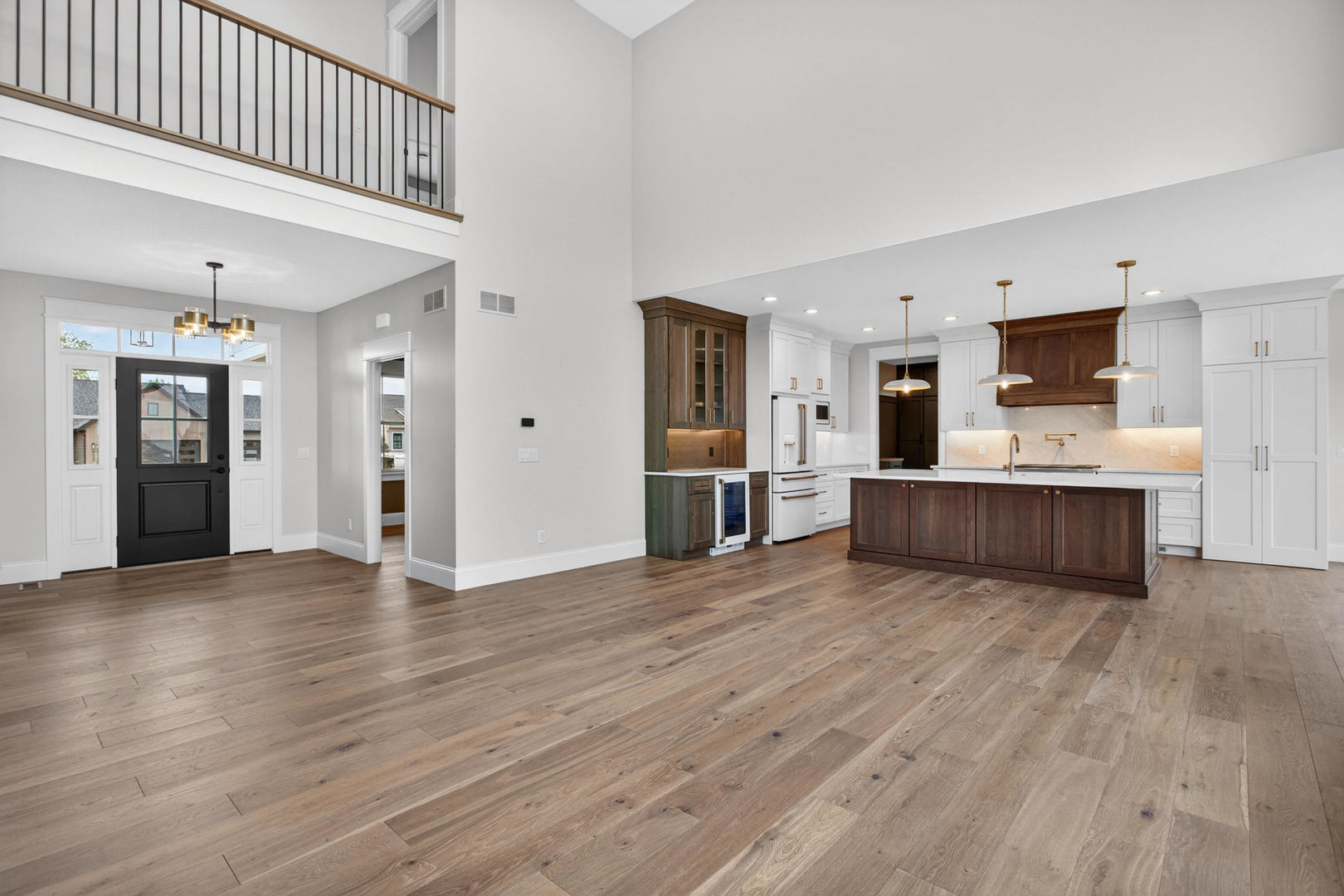 6928 Wilderness Pointe Bettendorf, IA 52722 - Photo 14 of 48 a view of a kitchen with wooden floor and windows