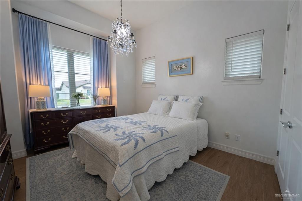 805 Grayson Avenue McAllen, TX 78504 - Photo 17 of 31 a bedroom with a large bed and a window