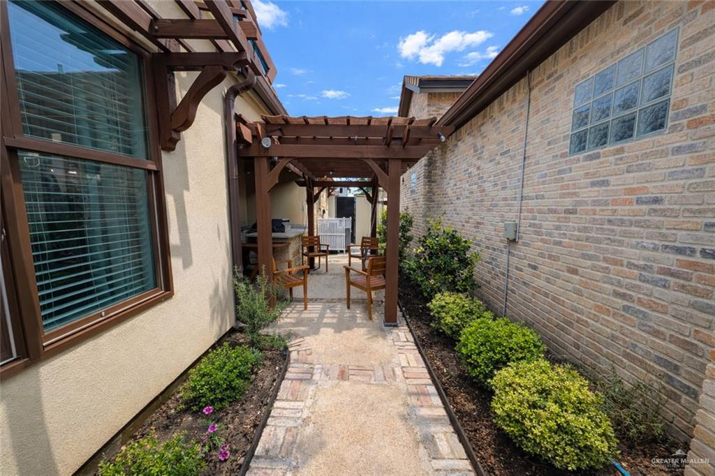 805 Grayson Avenue McAllen, TX 78504 - Photo 20 of 31 a view of a pathway both side of house