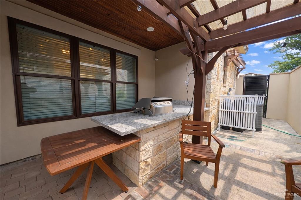 805 Grayson Avenue McAllen, TX 78504 - Photo 21 of 31 a view of backyard with a deck and furniture
