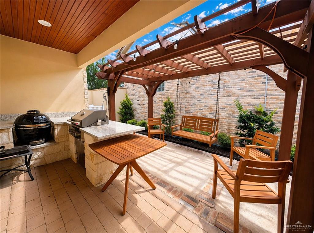805 Grayson Avenue McAllen, TX 78504 - Photo 24 of 31 a view of a chairs and table in the patio