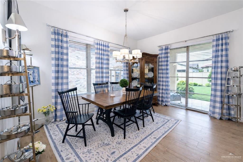 805 Grayson Avenue McAllen, TX 78504 - Photo 8 of 31 a view of a dining room with furniture window and wooden floor