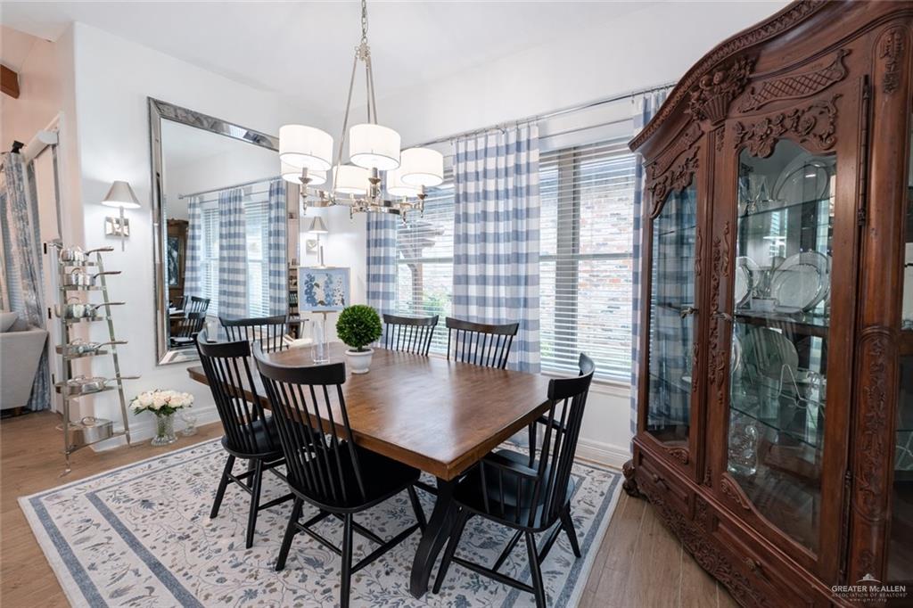 805 Grayson Avenue McAllen, TX 78504 - Photo 9 of 31 a view of a dining room with furniture window and wooden floor
