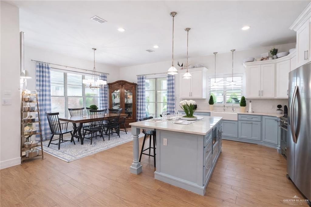 805 Grayson Avenue McAllen, TX 78504 - Photo 10 of 31 a kitchen with stainless steel appliances granite countertop counter top space a sink appliances and cabinets