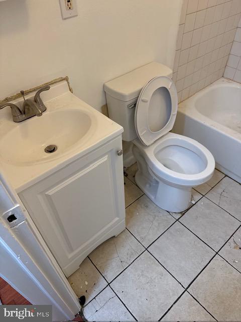2216 North Broad Street, Unit 2R Philadelphia, PA 19132 - Photo 4 of 4 a white toilet sitting next to a bathroom sink