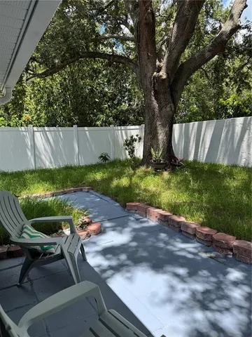a view of backyard with green space