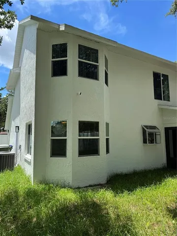 a view of a backyard of the house