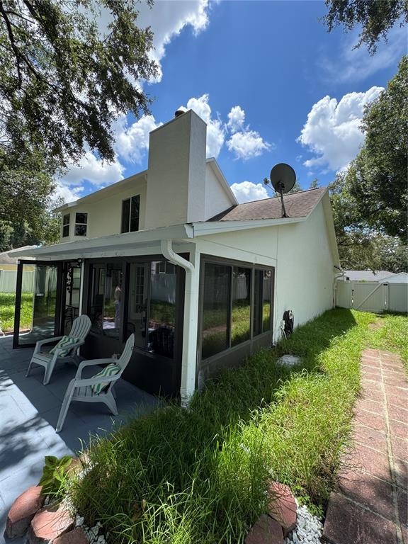 2633 Lanier Road Kissimmee, FL 34744 - Photo 18 of 45 a view of a house with backyard and sitting area
