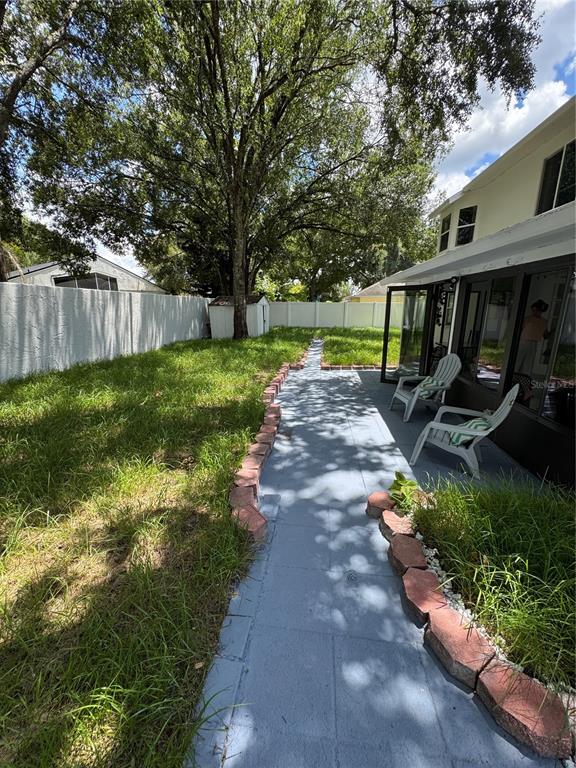 2633 Lanier Road Kissimmee, FL 34744 - Photo 20 of 45 a view of a backyard with wooden fence