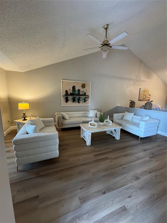 2633 Lanier Road Kissimmee, FL 34744 - Photo 2 of 45 a living room with hard wood floors and a ceiling fan