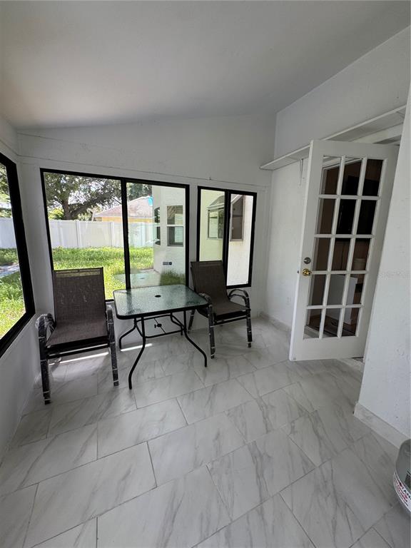 2633 Lanier Road Kissimmee, FL 34744 - Photo 22 of 45 a view of a livingroom with furniture and a large window