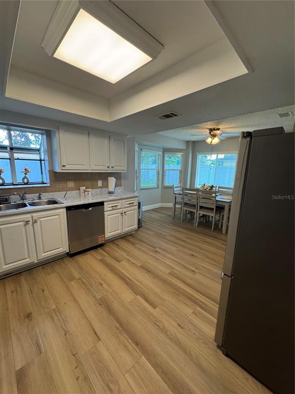 2633 Lanier Road Kissimmee, FL 34744 - Photo 23 of 45 a view of kitchen with wooden floor