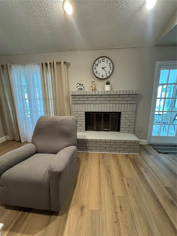 2633 Lanier Road Kissimmee, FL 34744 - Photo 30 of 45 a living room with furniture and a fireplace