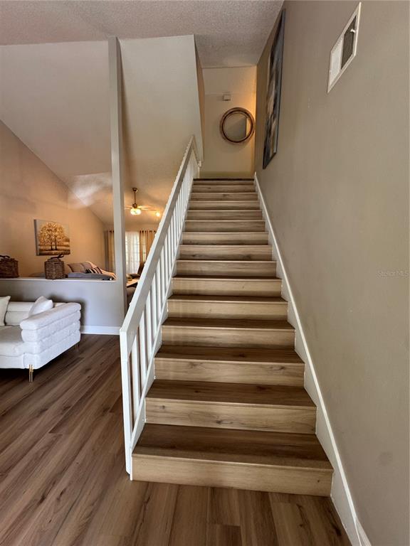 2633 Lanier Road Kissimmee, FL 34744 - Photo 32 of 45 a view of entryway and hall with wooden floor