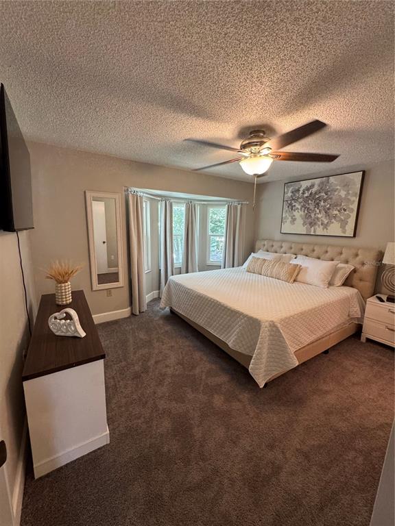 2633 Lanier Road Kissimmee, FL 34744 - Photo 36 of 45 a bedroom with a bed and a walk in closet