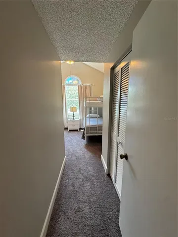 a view of hallway with livingroom