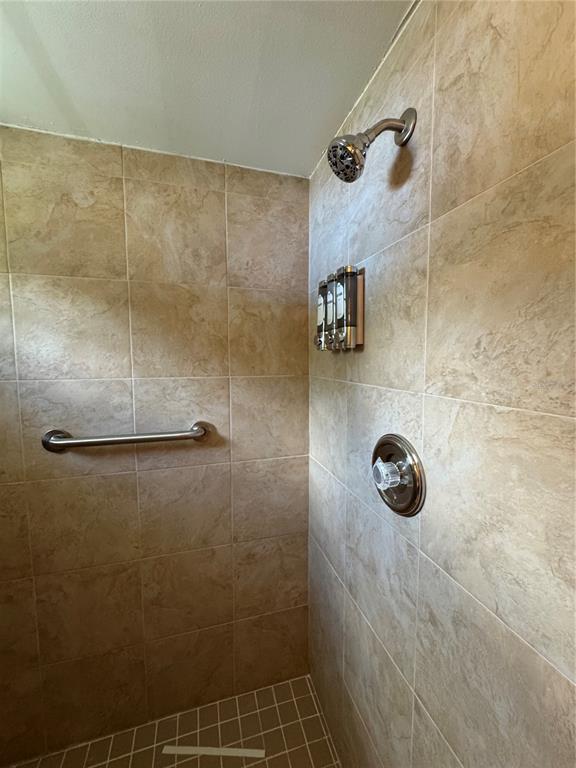 2633 Lanier Road Kissimmee, FL 34744 - Photo 40 of 45 a bathroom with a shower