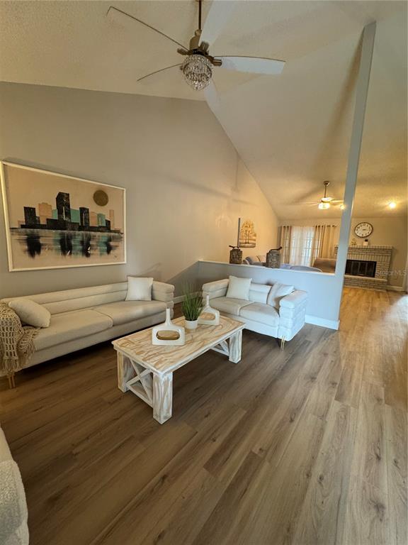 2633 Lanier Road Kissimmee, FL 34744 - Photo 4 of 45 a living room with furniture and a wooden floor