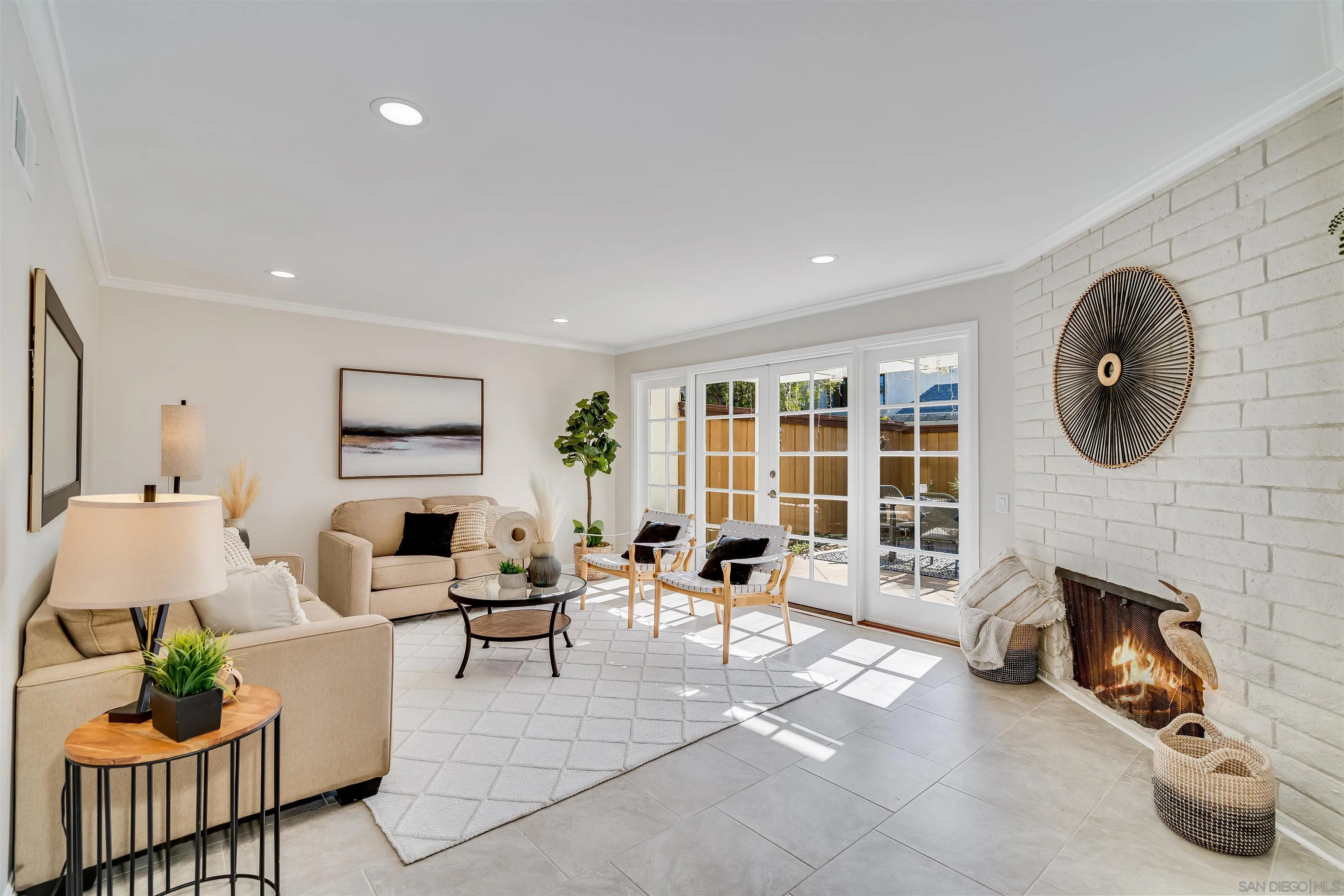 20 GingerTree Lane Coronado, CA 92118 - Photo 1 of 45 a living room with furniture a fireplace and a flat screen tv