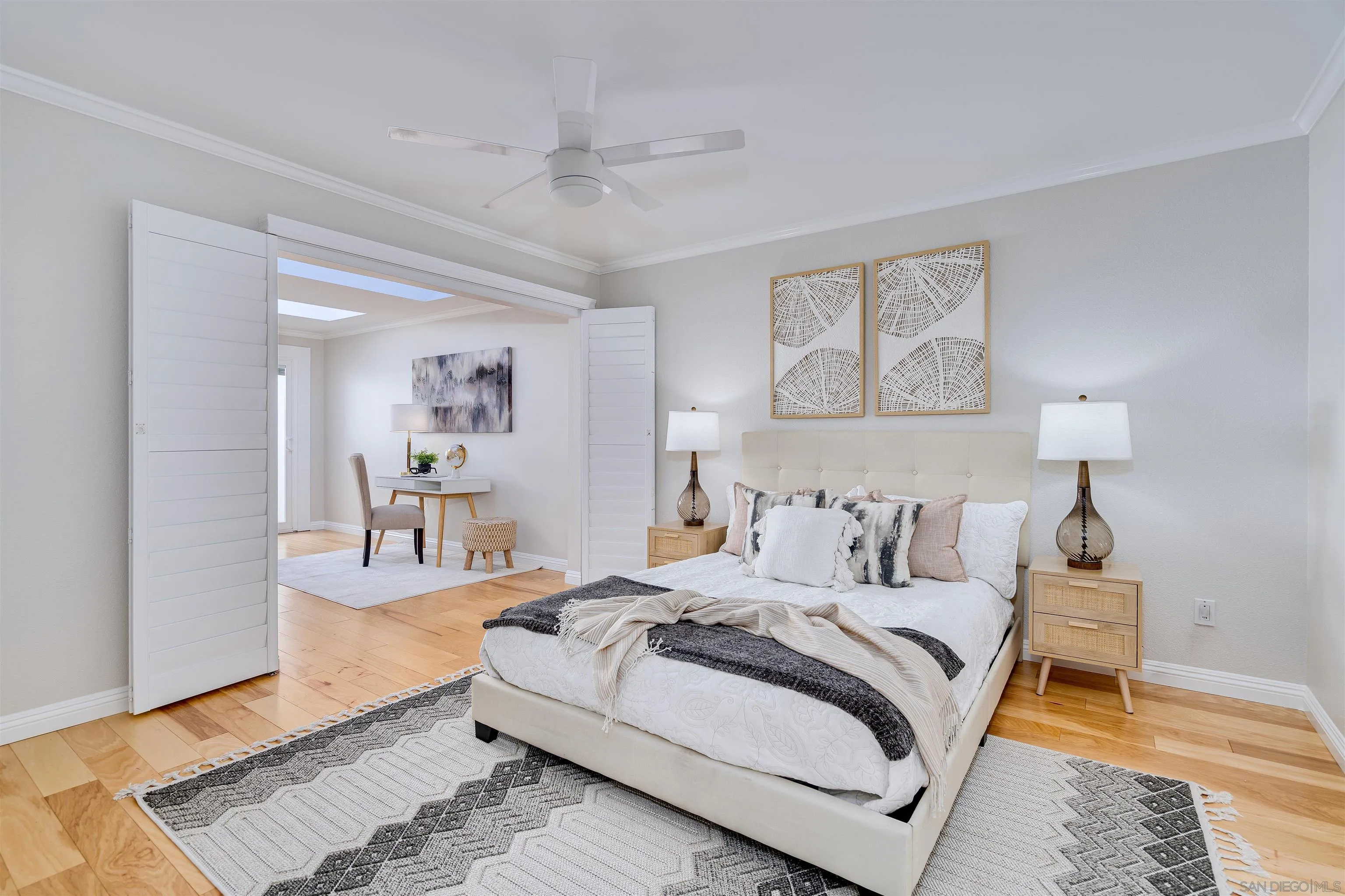 20 GingerTree Lane Coronado, CA 92118 - Photo 14 of 45 a bedroom with a bed wooden floor and painting on the wall