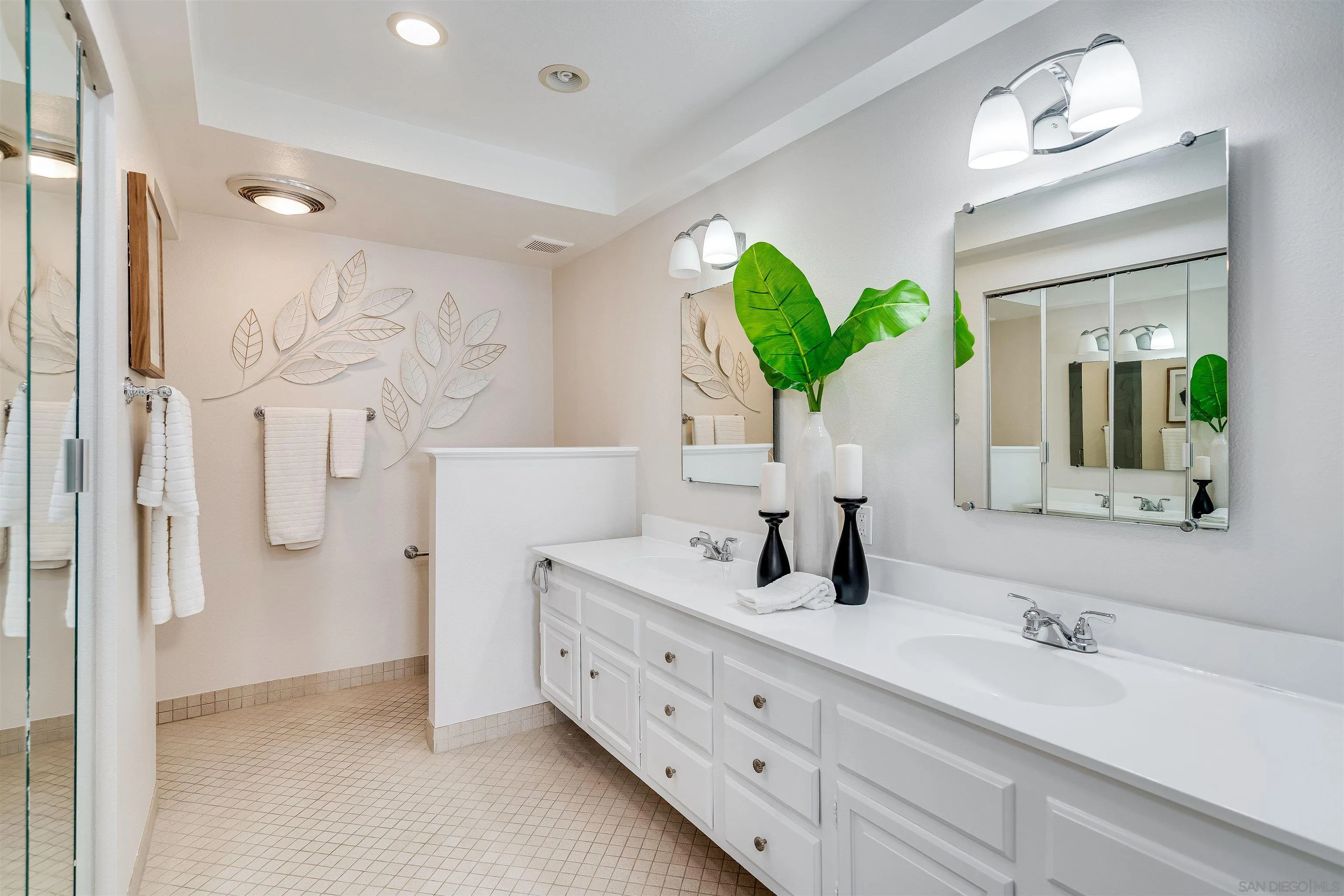 20 GingerTree Lane Coronado, CA 92118 - Photo 19 of 45 a bathroom with a double vanity sink mirror and shower