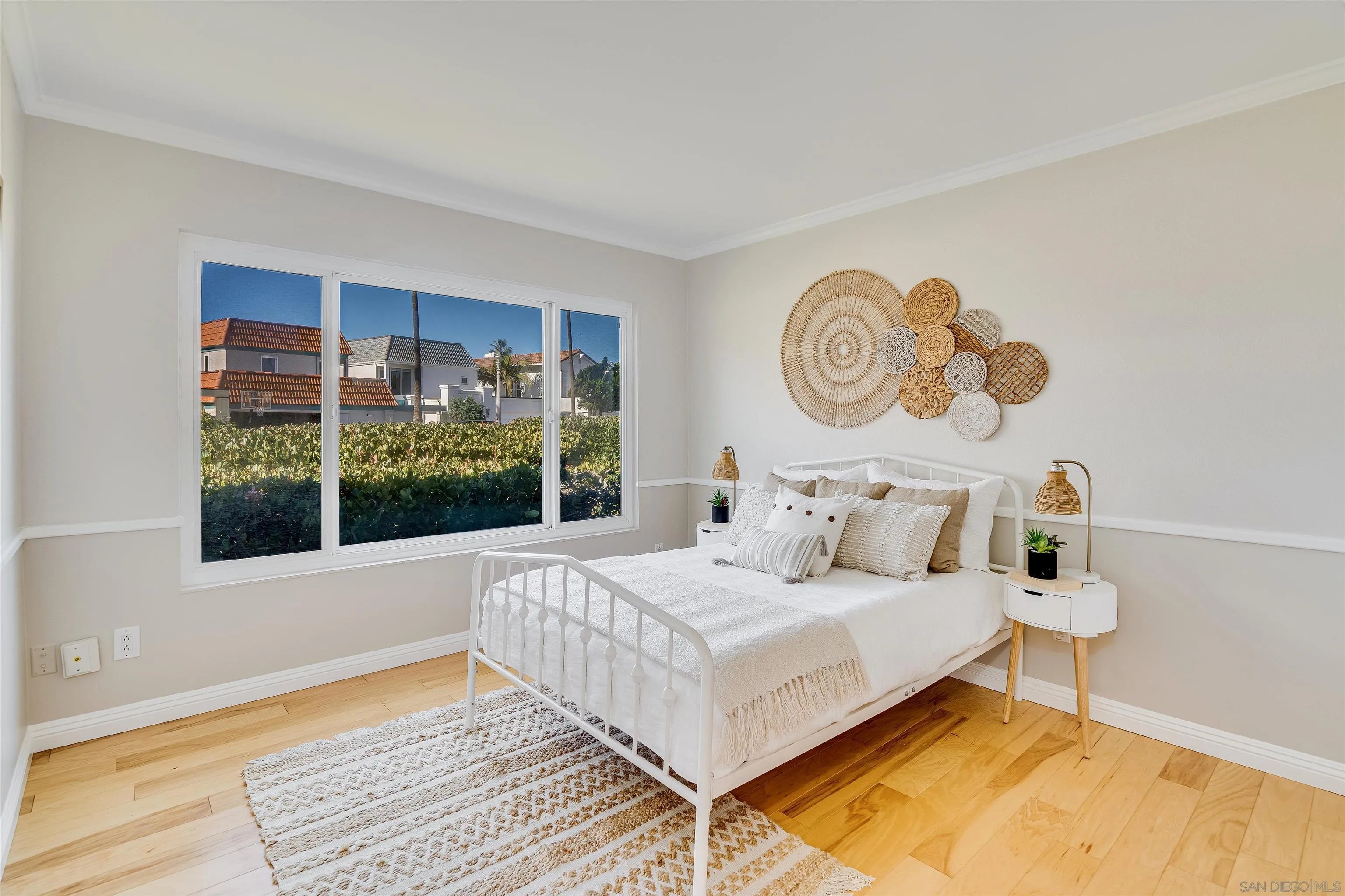 20 GingerTree Lane Coronado, CA 92118 - Photo 23 of 45 a bedroom with a bed and a window