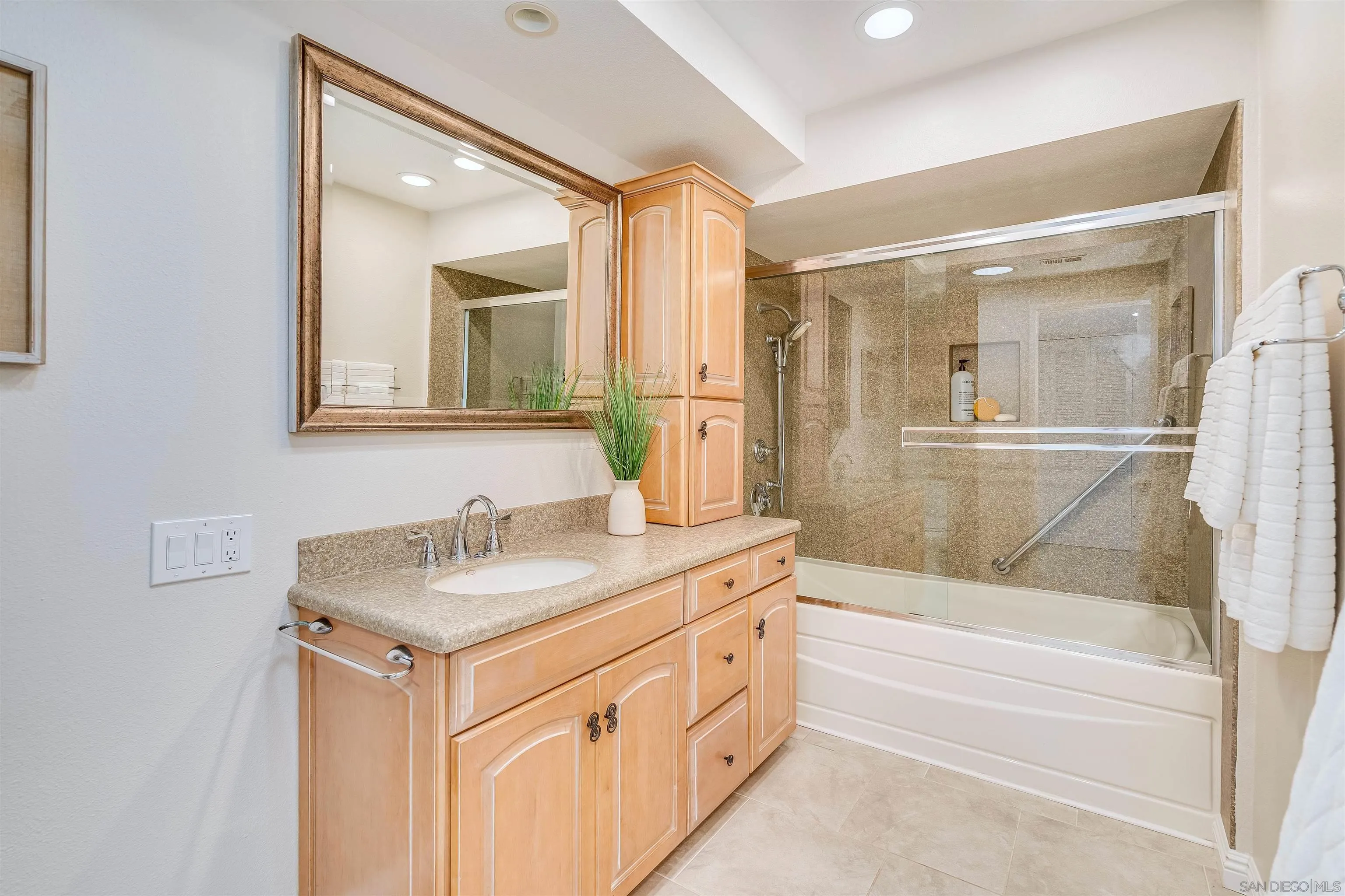 20 GingerTree Lane Coronado, CA 92118 - Photo 24 of 45 a bathroom with a tub sink and mirror