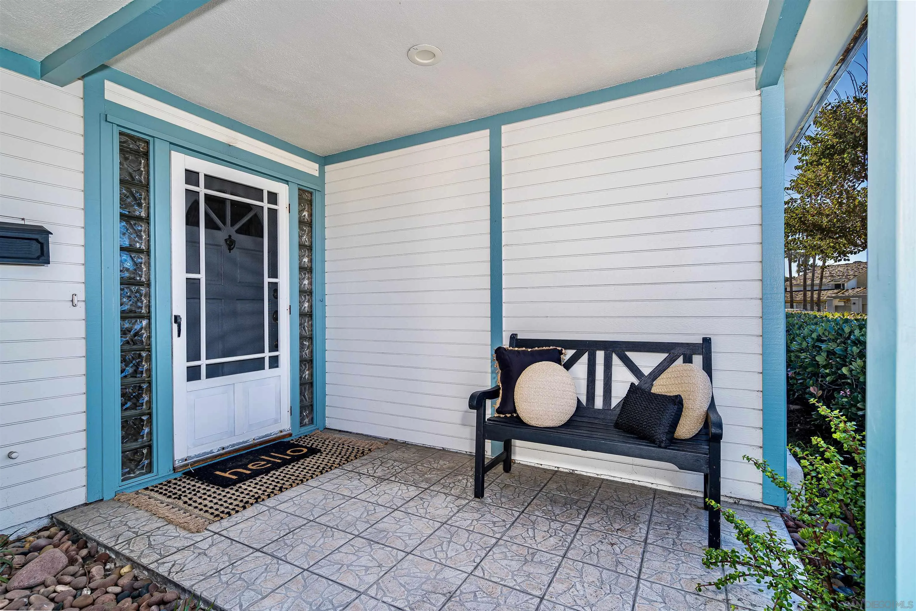 20 GingerTree Lane Coronado, CA 92118 - Photo 25 of 45 a bench sitting in front of a house