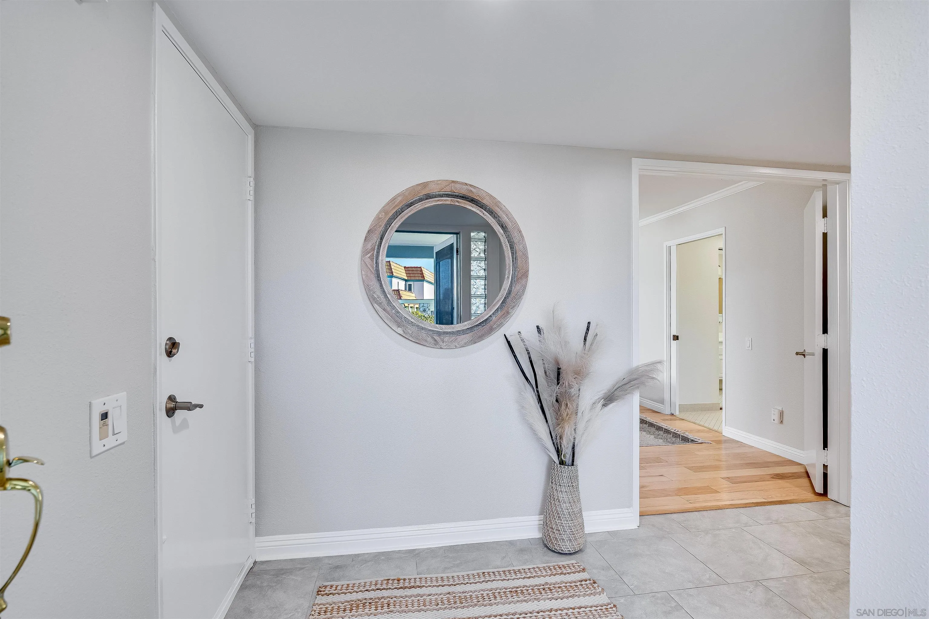 20 GingerTree Lane Coronado, CA 92118 - Photo 26 of 45 a view of a livingroom with wooden floor and a potted plant