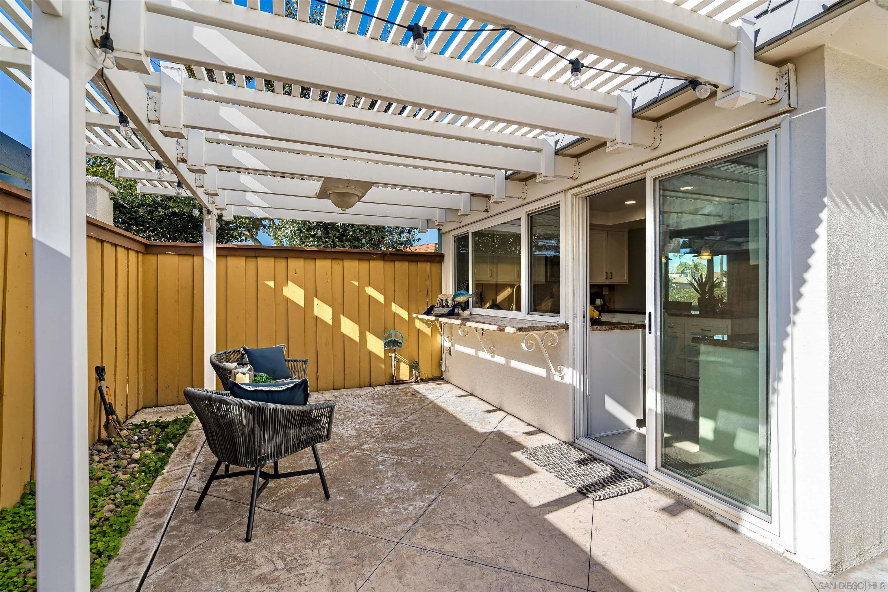 20 GingerTree Lane Coronado, CA 92118 - Photo 30 of 45 a building outdoor space with patio furniture and potted plants