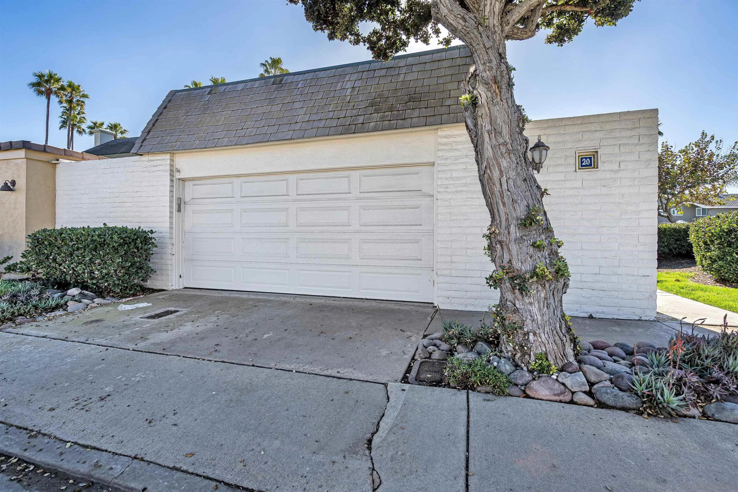 20 GingerTree Lane Coronado, CA 92118 - Photo 41 of 45 a view of a house with a yard and potted plants
