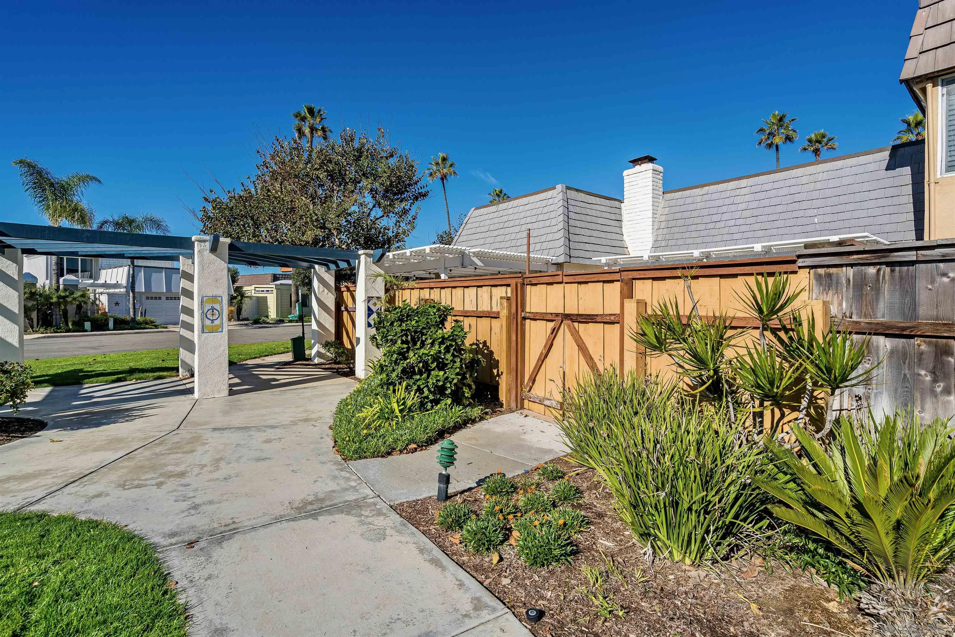 20 GingerTree Lane Coronado, CA 92118 - Photo 45 of 45 a front view of a house with garden
