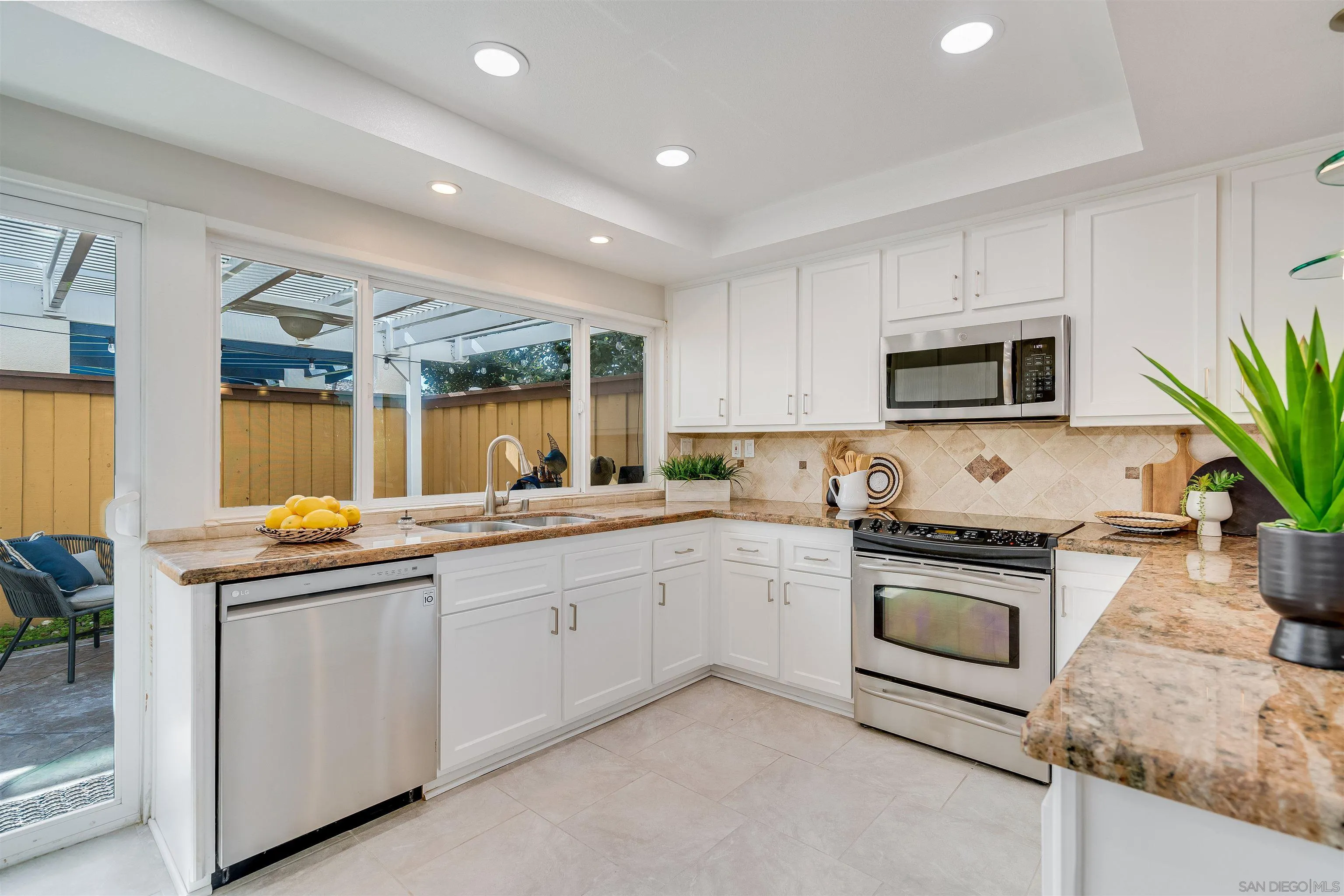 20 GingerTree Lane Coronado, CA 92118 - Photo 9 of 45 a kitchen with sink a microwave and stove