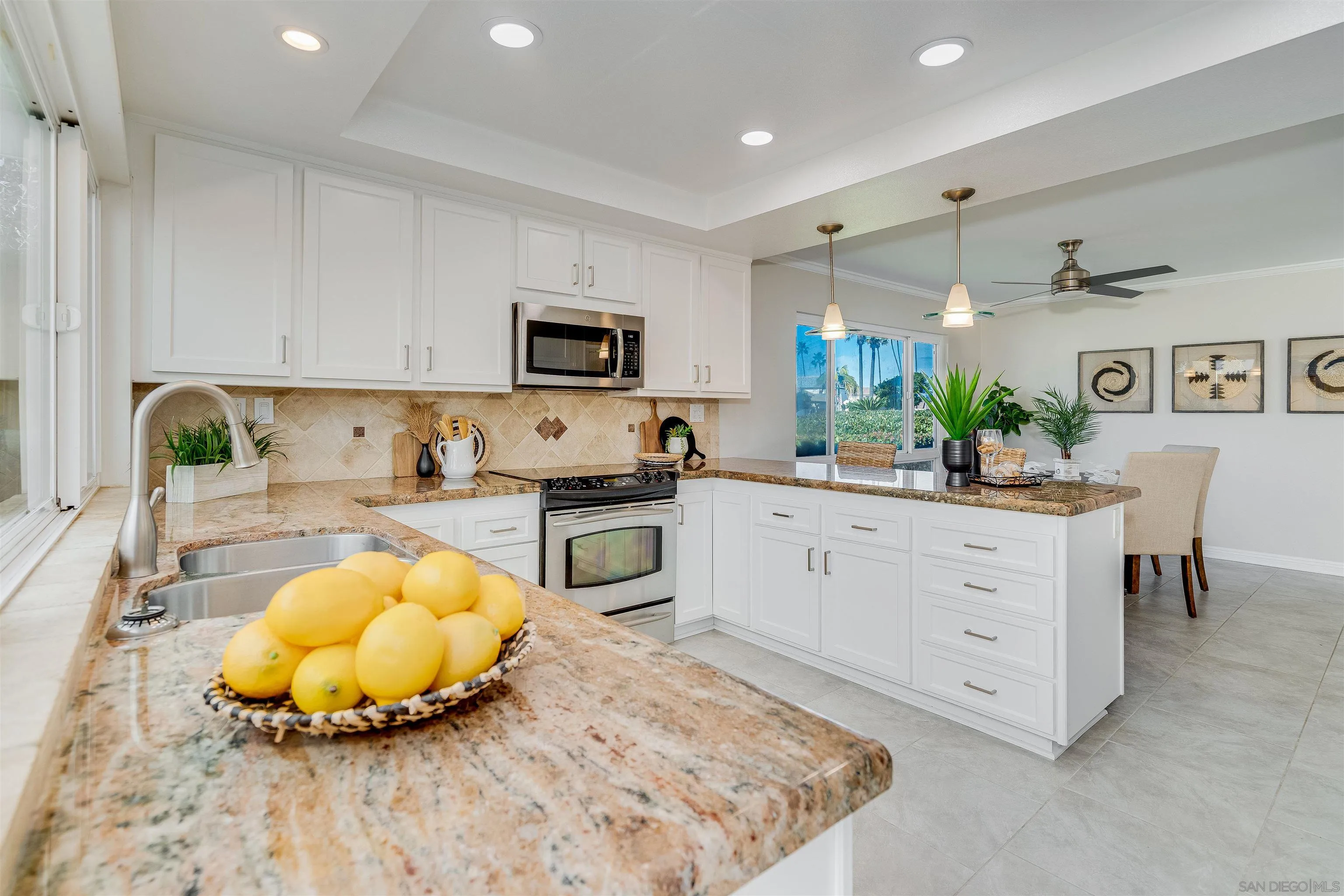 20 GingerTree Lane Coronado, CA 92118 - Photo 10 of 45 a kitchen with a white cabinets and chairs