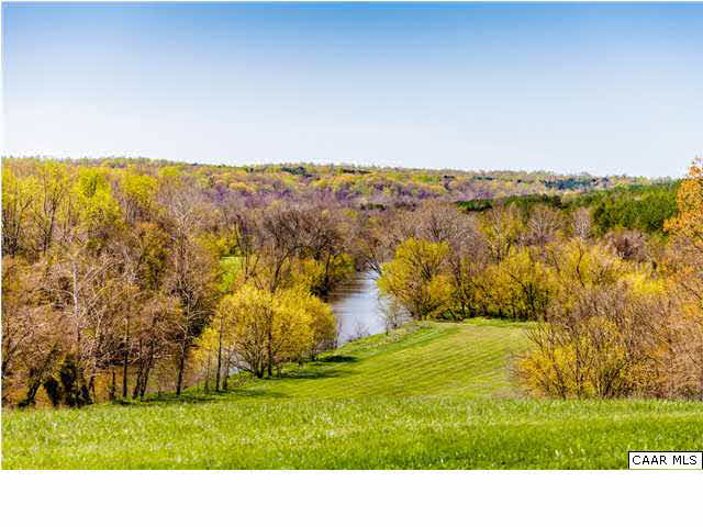 a view of open space with a lake view