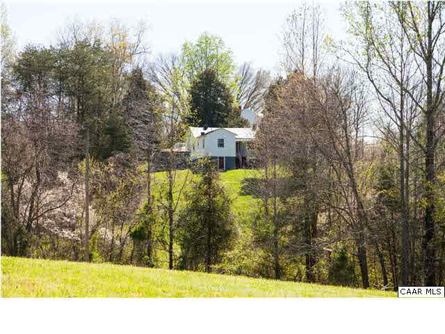 268 Rivanna Mills Road Palmyra, VA 22963 - Photo 12 of 31 a view of a yard with large trees