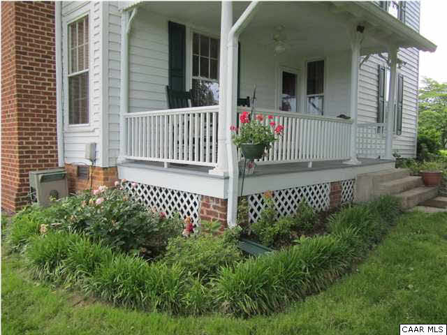 268 Rivanna Mills Road Palmyra, VA 22963 - Photo 19 of 31 a front view of a house with a garden