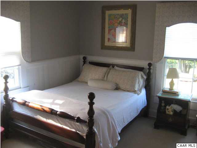 268 Rivanna Mills Road Palmyra, VA 22963 - Photo 30 of 31 a bedroom with a bed and windows