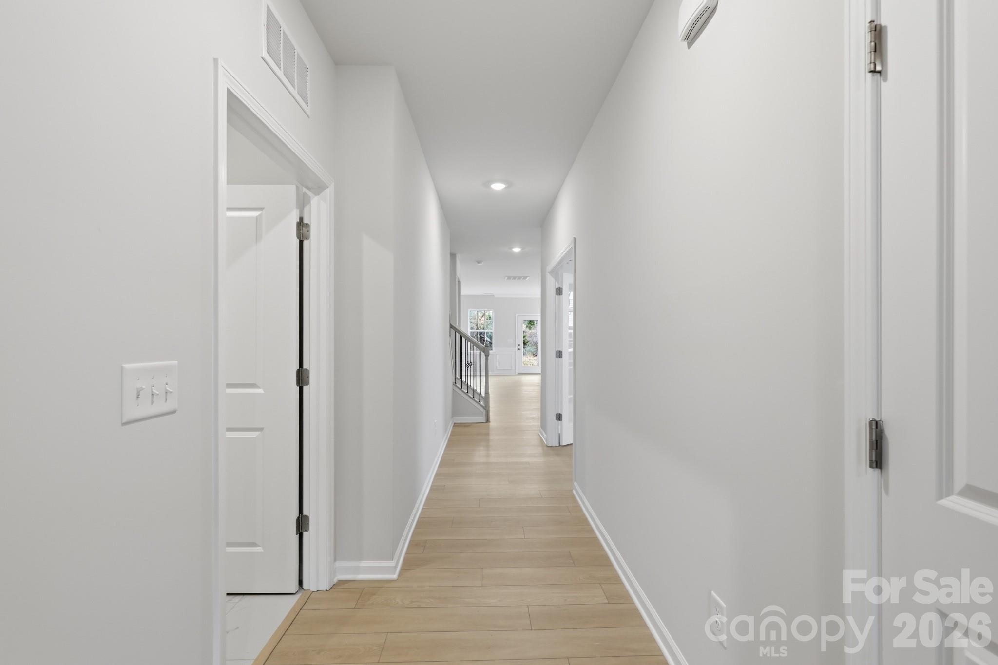 5450 Redbud Road, Unit 66 Lancaster, SC 29720 - Photo 30 of 35 a view of a hallway with wooden floor