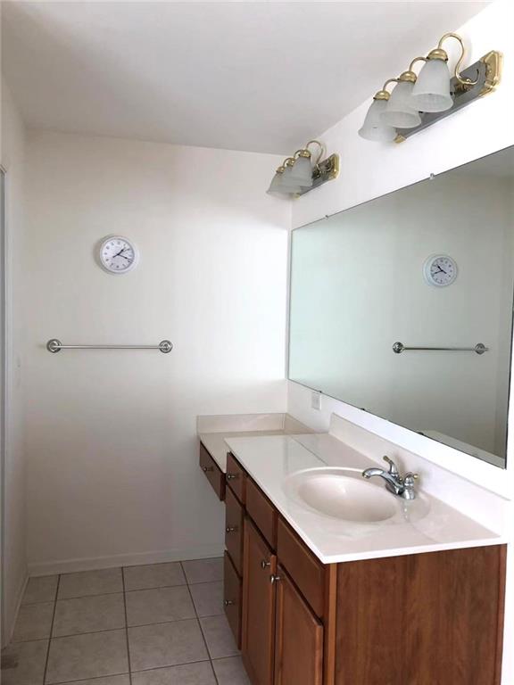 5876 Rue Villa Lane Tucker, GA 30084 - Photo 11 of 17 a bathroom with a sink and a mirror