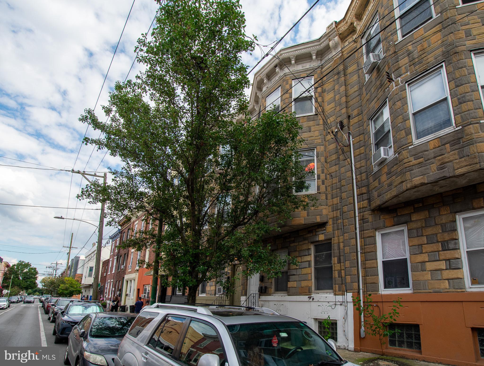 616 Tasker Street, Unit 2 Philadelphia, PA 19148 - Photo 22 of 22 a front view of a building with trees