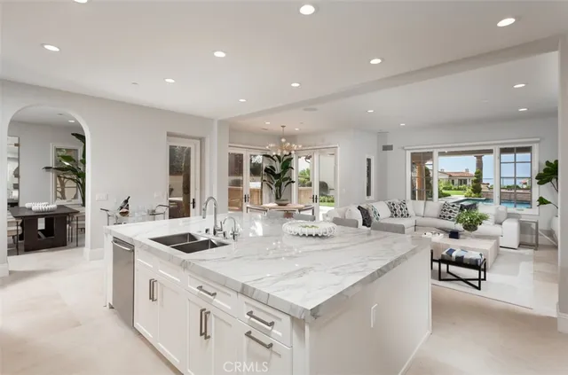 a kitchen with sink stove and cabinets