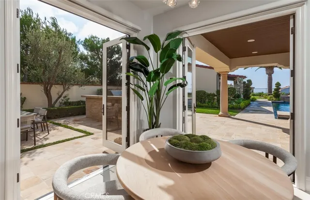 a view of a dining room with furniture window and outside view