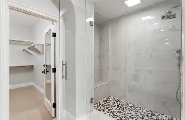 a bathroom with a shower and a sink